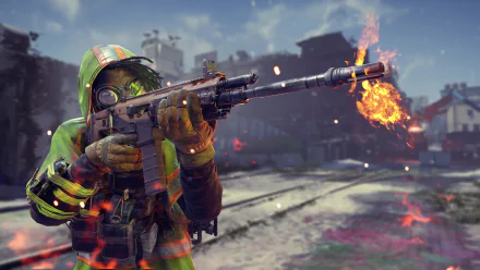 HD wallpaper featuring an intense scene from the video game XDefiant, showing a character in a green hooded outfit, firing a weapon with flames in an urban environment.