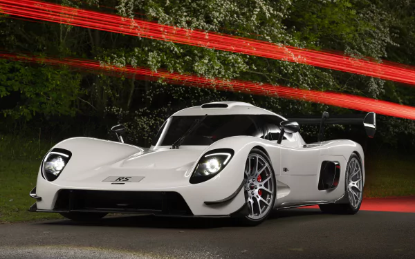 HD desktop wallpaper of a white Ultima RS sports car with dynamic red light streaks in the background.