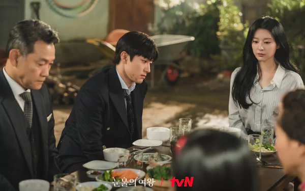 HD wallpaper featuring a scene from the TV show Queen of Tears with three characters at a dining table, displaying the tvN logo.