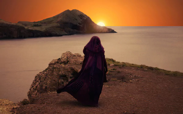 HD desktop wallpaper featuring a cloaked figure from The Acolyte (2024) overlooking a sunset by the sea.