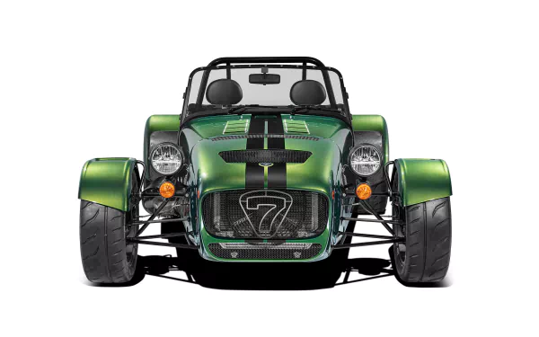 HD desktop wallpaper featuring a green Caterham Seven 485 sports car viewed from the front, showcasing its sleek design and distinctive number 7 grille.