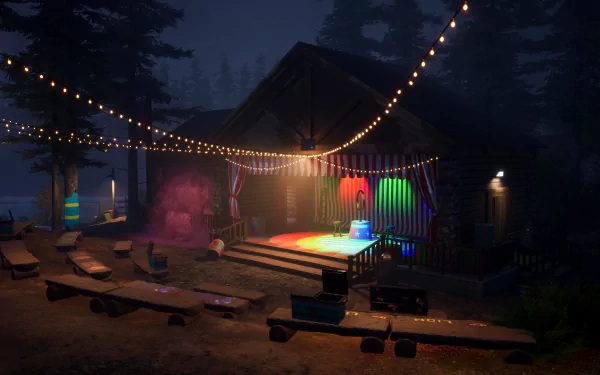 HD desktop wallpaper of Killer Klowns from Outer Space: The Game, featuring a spooky nighttime scene with a lit stage, string lights, and scattered seating in a wooded area.