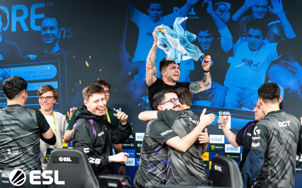 9z Team players celebrating their victory at an esports event, with ESL branding in the background. High-definition desktop wallpaper showcasing the excitement of competitive gaming.
