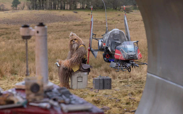 HD desktop wallpaper from the TV show The Acolyte (2024), featuring Chewbacca sitting in a field beside a futuristic vehicle.