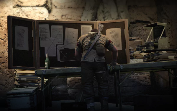 HD desktop wallpaper and background featuring Sniper Elite III, showcasing a character intently studying plans on a table laden with documents and maps in a dimly lit setting.
