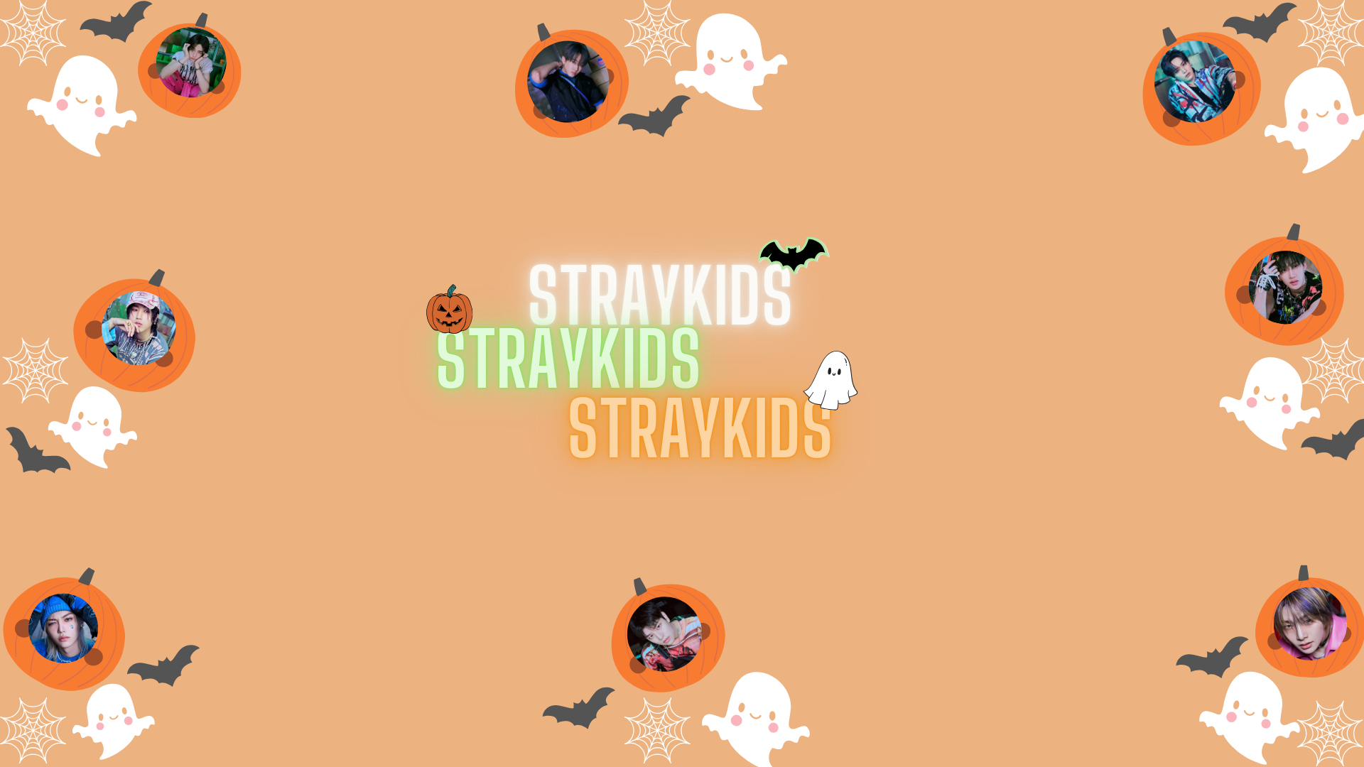 HD PC desktop wallpaper featuring K-pop group Stray Kids with Halloween-themed icons like ghosts, bats, and pumpkins on an orange background.
