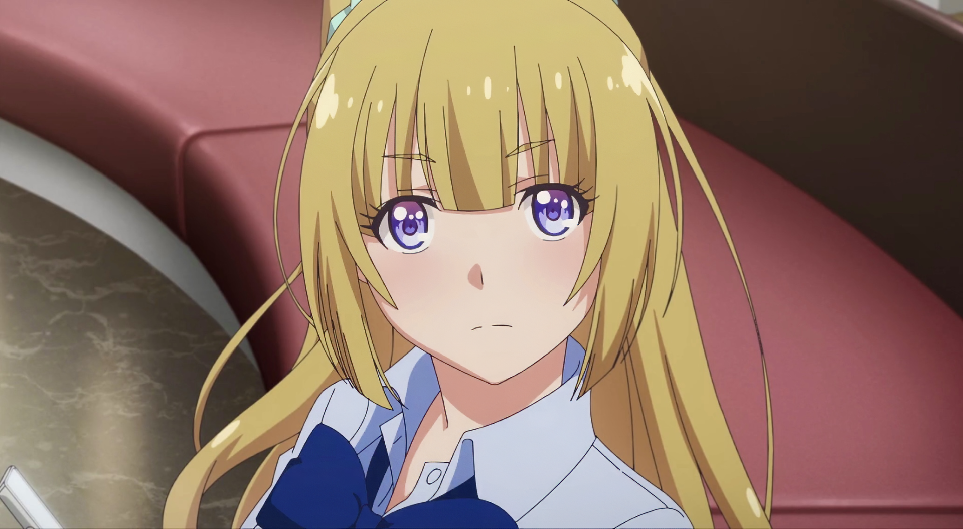 HD desktop wallpaper featuring Kei Karuizawa from the anime Classroom of the Elite, showcasing her distinct blonde hair and expressive violet eyes in a classroom setting.