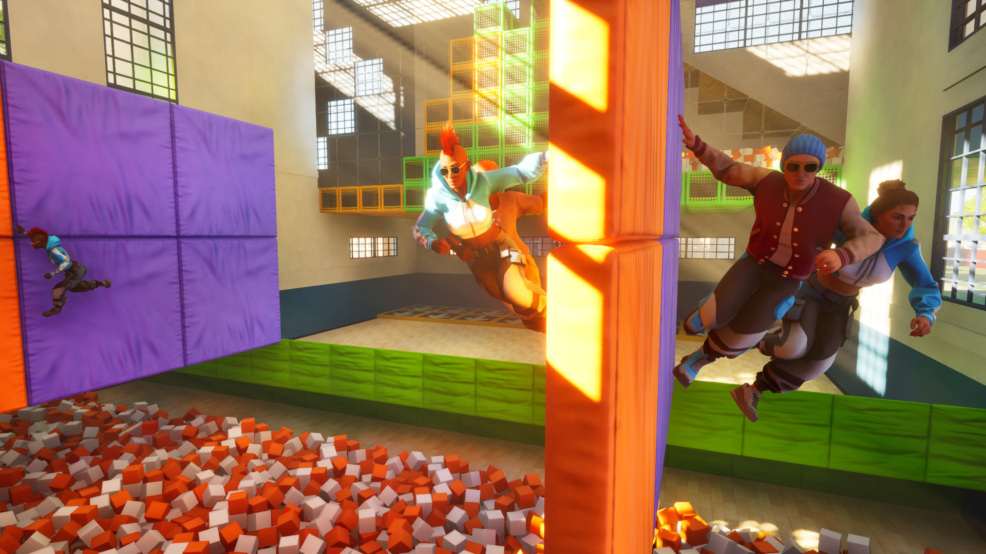 Dynamic scene from a video game featuring characters executing supermoves in an indoor arena filled with colorful blocks and foam pits, set against a vibrant, sunny backdrop.