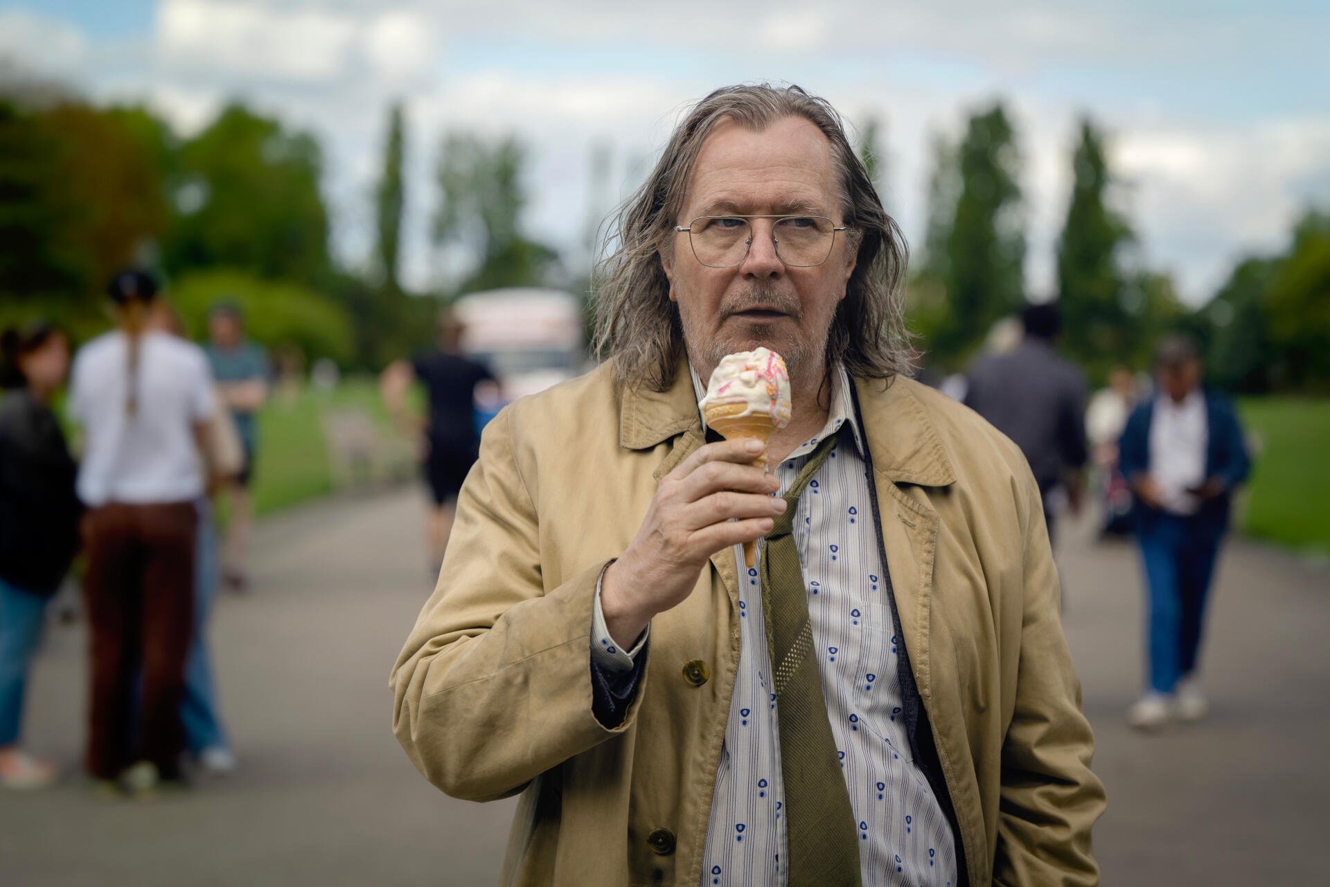 A sleek 4K Ultra HD desktop wallpaper featuring Gary Oldman from the TV show Slow Horses, showcasing a moody and engaging atmosphere.
