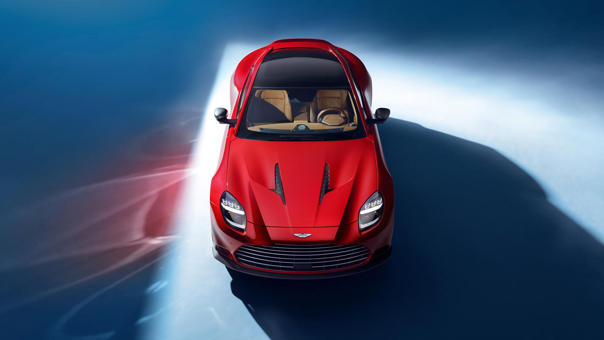 A high-quality 4K Ultra HD background featuring the Aston Martin Vanquish, showcasing its sleek design and luxury appeal.