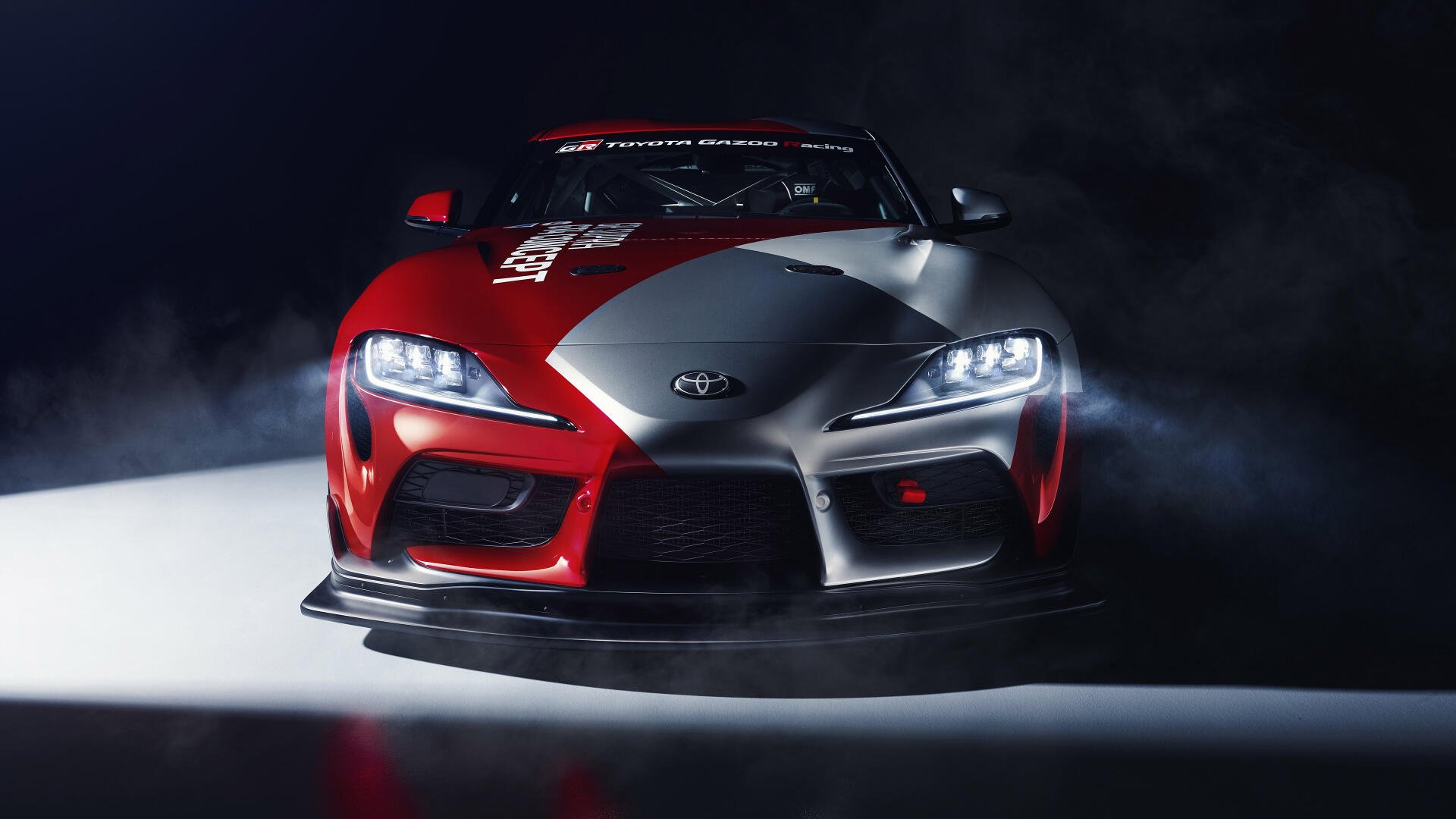 A sleek Toyota Supra parked against a dynamic backdrop, showcasing its sporty design and performance. This 4K Ultra HD image serves as an eye-catching desktop wallpaper.
