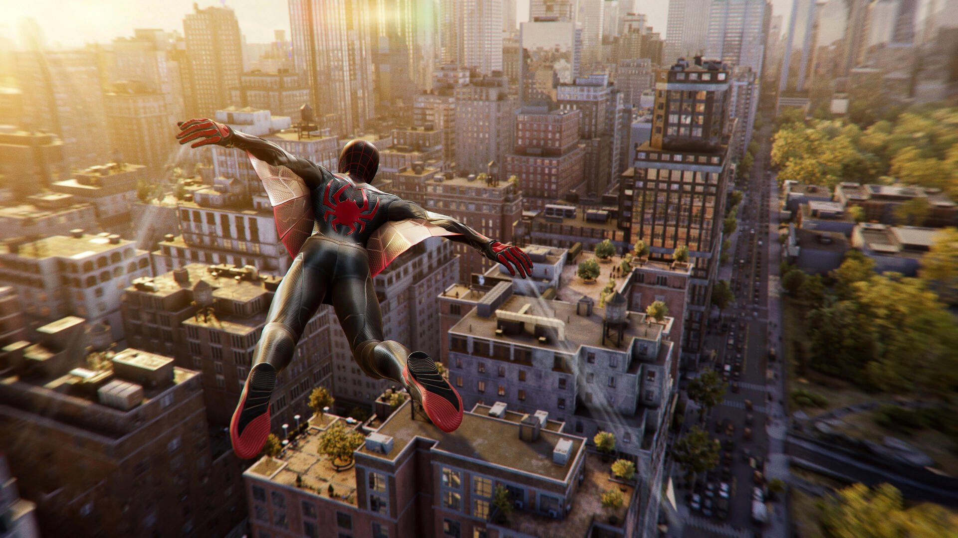 HD PC desktop wallpaper featuring Miles Morales swinging through a detailed cityscape from Marvel's Spider-Man 2.