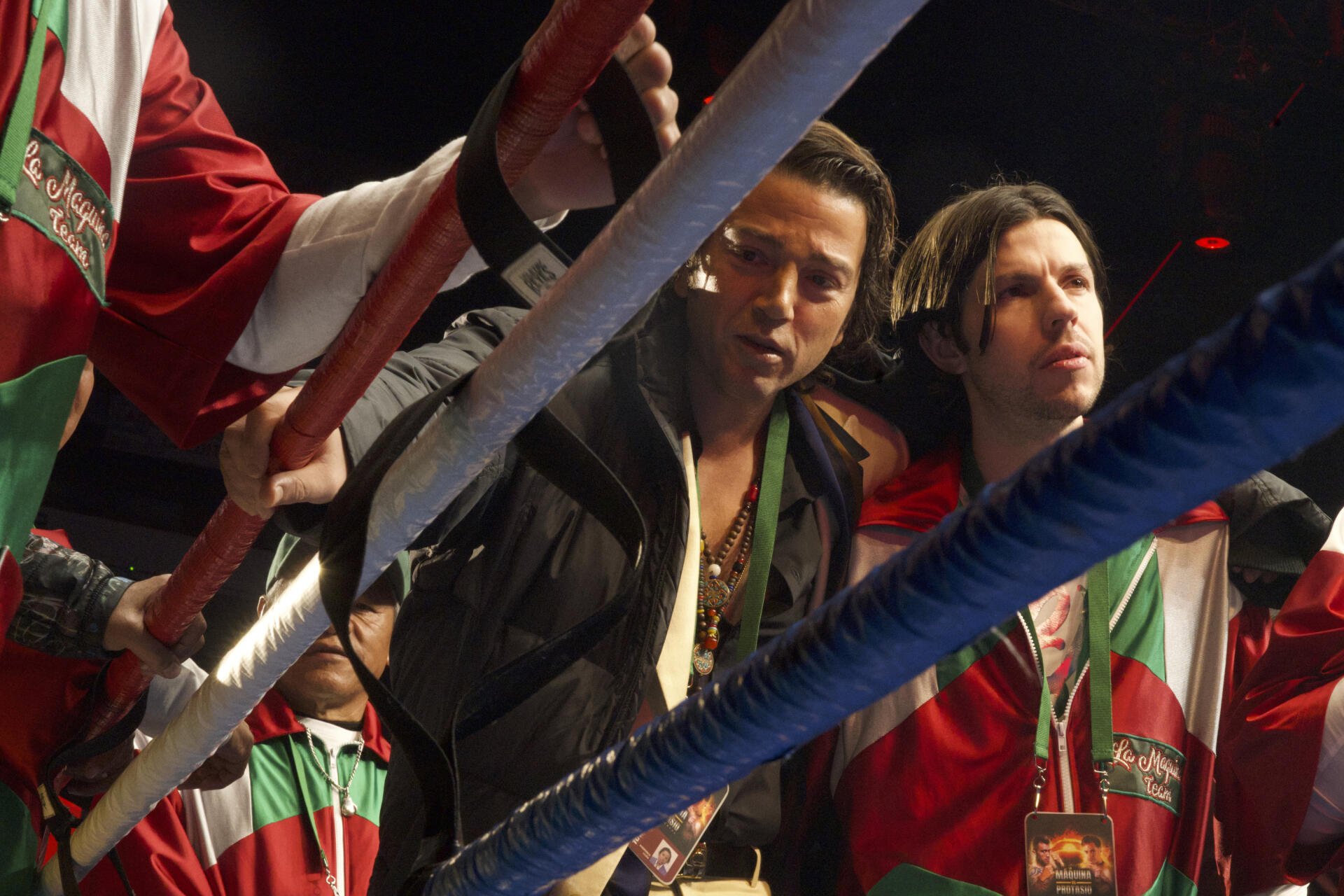 A dynamic scene from the TV show La Máquina (2024), featuring characters in boxing attire, poised in a ring, showcasing the intensity of the sport. HD desktop wallpaper.