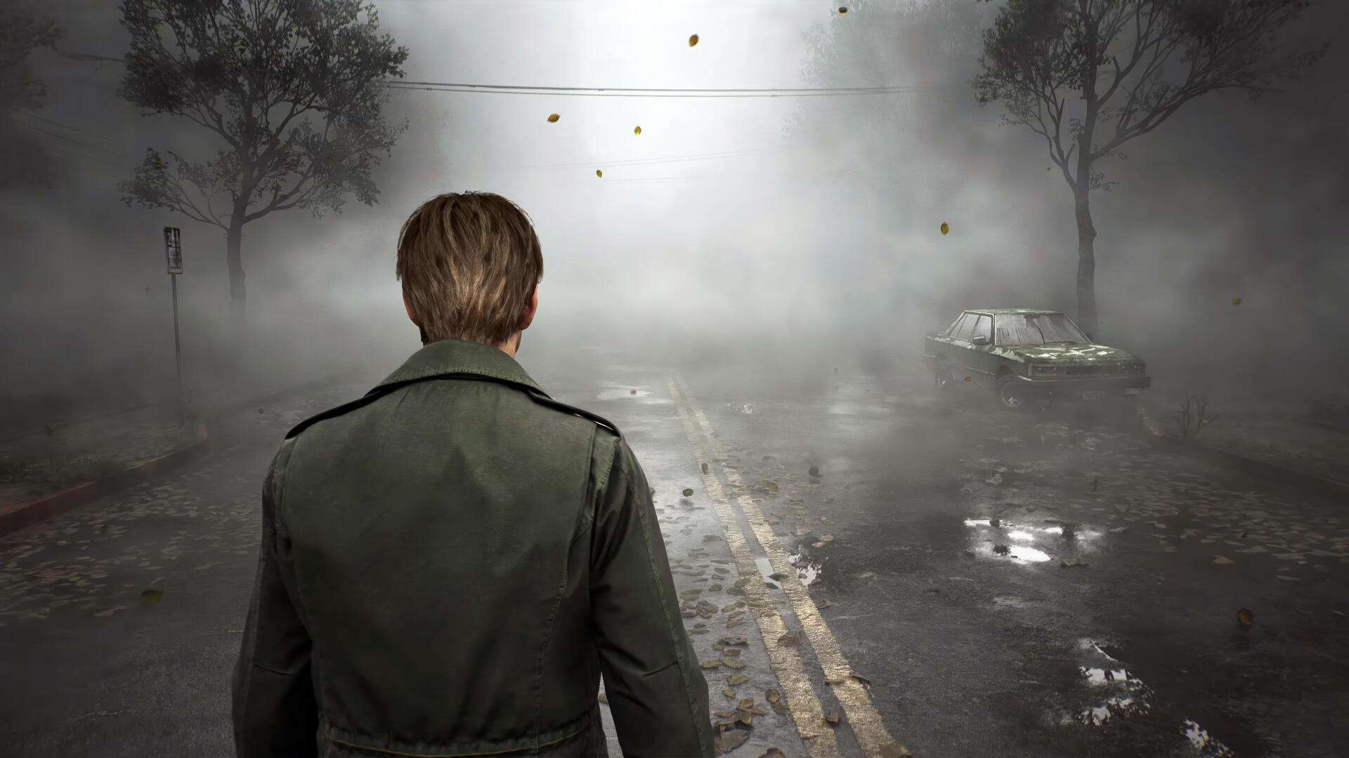 A 4K Ultra HD wallpaper featuring a character from the video game Silent Hill 2, standing on a misty road with a desolate car in the background, creating an eerie atmosphere.
