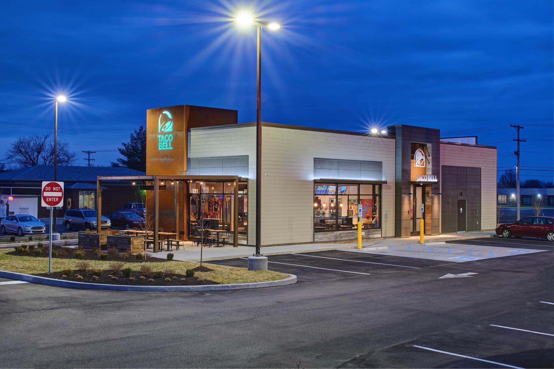 A man-made Taco Bell restaurant illuminated at dusk, captured in 4K Ultra HD as a detailed PC desktop wallpaper and background.
