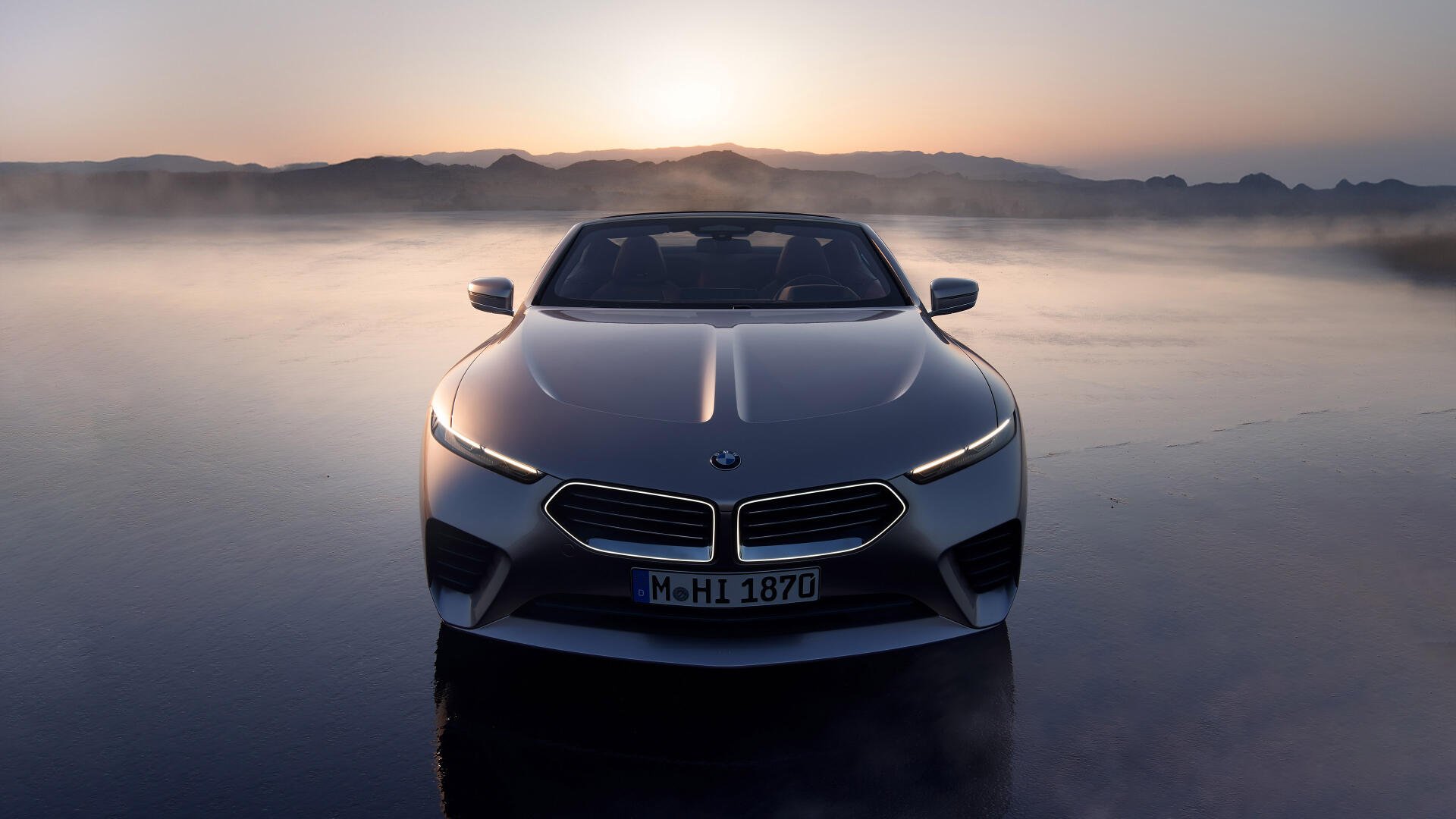 A sleek BMW Skytop stands prominently against a misty backdrop, showcasing its striking design in this 4K Ultra HD desktop wallpaper.