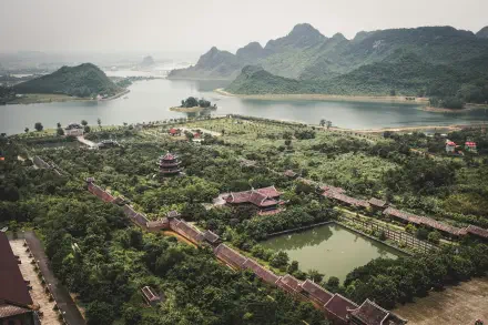 A stunning 4K Ultra HD landscape of Vietnam, showcasing lush greenery, serene lakes, and distant mountains, offering a tranquil view of nature's beauty.