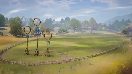 HD wallpaper featuring a serene quidditch pitch from the video game Harry Potter: Quidditch Champions, showcasing three iconic goal hoops set against a beautiful landscape.