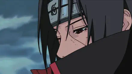 A high-definition desktop wallpaper featuring Itachi Uchiha from Naruto, showcasing his intense expression and Mangekyō Sharingan. An engaging anime background for fans.