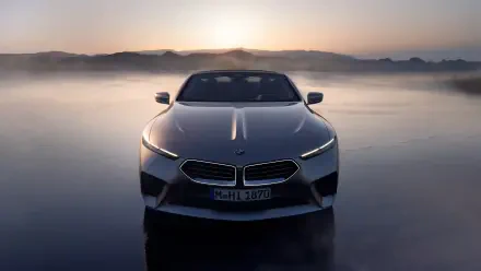 A sleek BMW Skytop stands prominently against a misty backdrop, showcasing its striking design in this 4K Ultra HD desktop wallpaper.