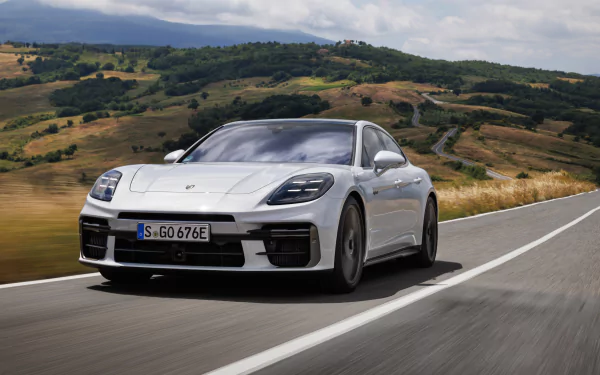 HD wallpaper featuring a sleek Porsche Panamera Turbo S E-Hybrid, showcasing its dynamic design and luxurious appeal. A striking background for car enthusiasts.