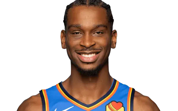Shai Gilgeous-Alexander smiles in a vibrant Oklahoma City Thunder jersey against a simple background, capturing the energy of the NBA in a striking HD desktop wallpaper.