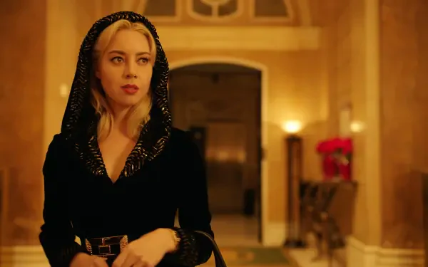 Aubrey Plaza stars in the movie Megalopolis (2024), captured in a stylish scene that showcases a lavish interior and her distinctive fashion, making for a striking HD desktop wallpaper.