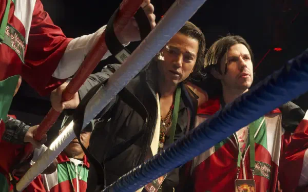 A dynamic scene from the TV show La Máquina (2024), featuring characters in boxing attire, poised in a ring, showcasing the intensity of the sport. HD desktop wallpaper.