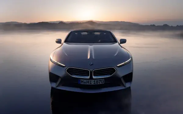A sleek BMW Skytop stands prominently against a misty backdrop, showcasing its striking design in this 4K Ultra HD desktop wallpaper.