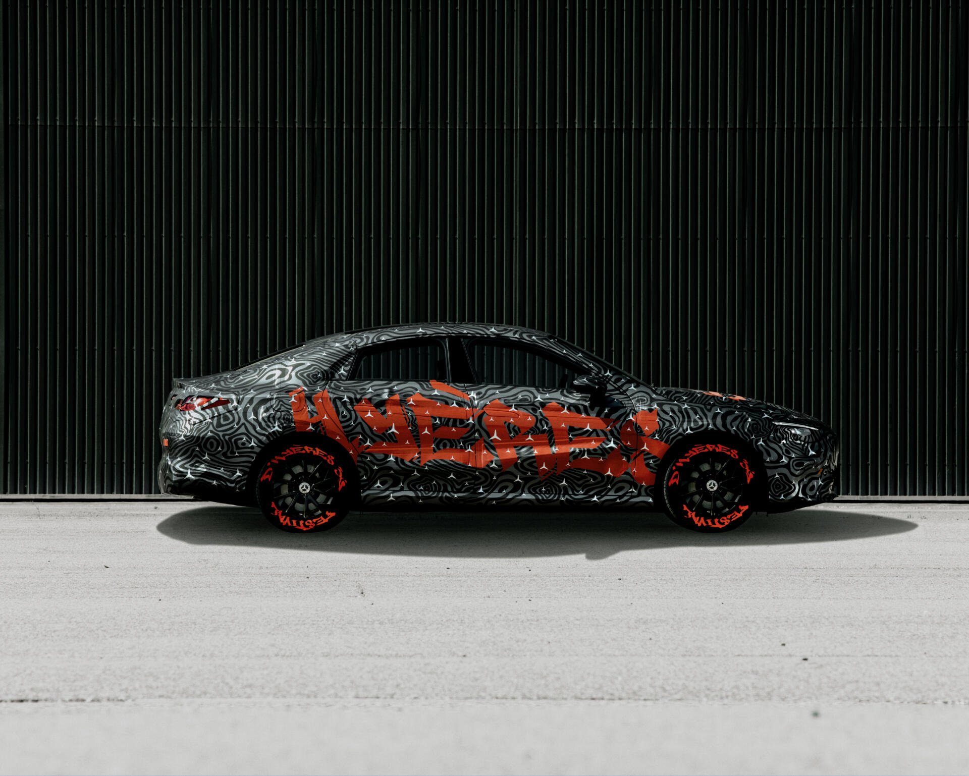 A sleek Mercedes-Benz CLA showcased in a striking design, featuring bold graphics. This HD image makes for an impressive desktop wallpaper and background.