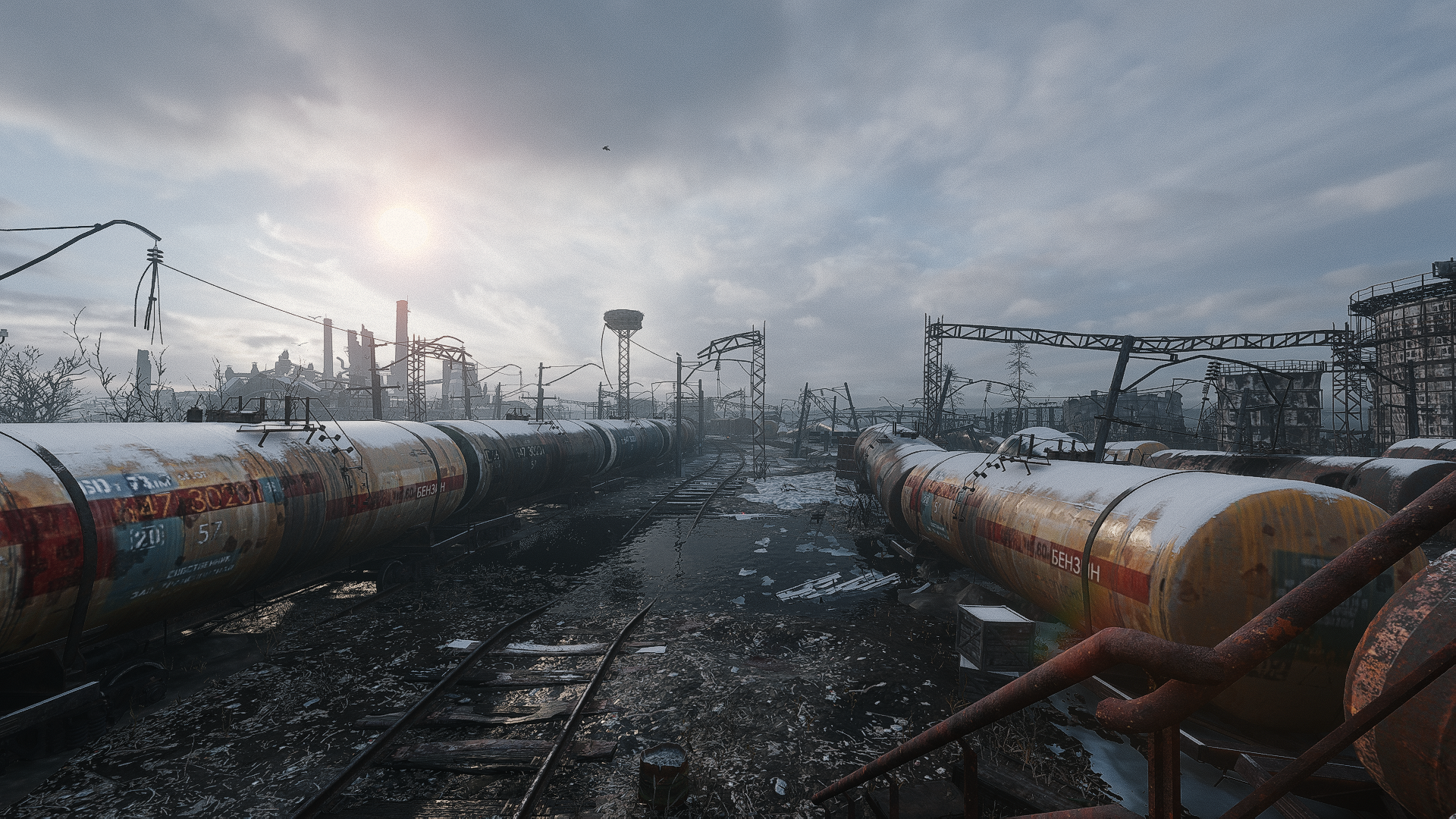 A desolate landscape from Metro Exodus featuring abandoned train cars and a cloudy sky, captured in high-definition as a striking PC desktop wallpaper.