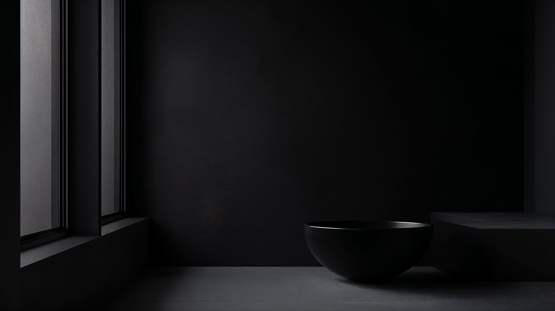 A dark minimalist scene featuring a simple bowl on a smooth surface, illuminated by soft natural light from a window, rendered in 4K Ultra HD for a sleek desktop wallpaper.