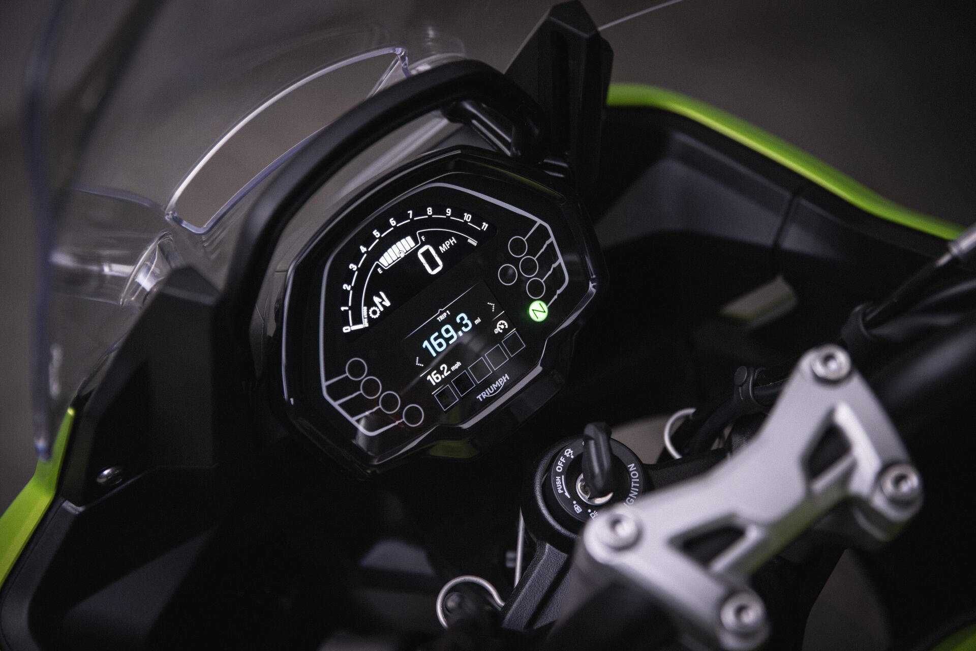Close-up of the digital dashboard on a Triumph Tiger Sport 660 motorcycle, showcased in a 4K Ultra HD PC desktop wallpaper and background.