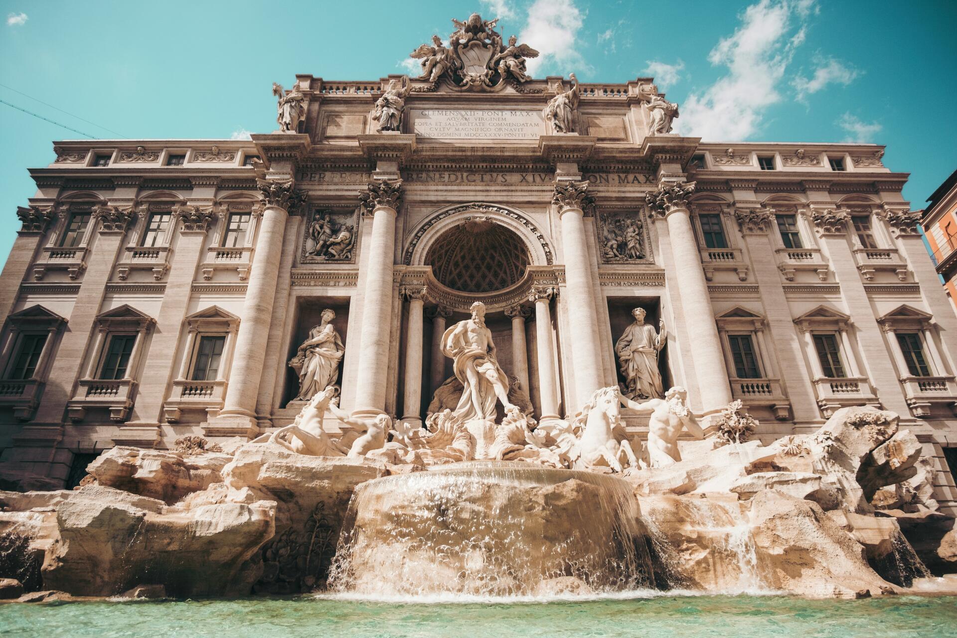 A stunning view of the Trevi Fountain in Rome, Italy, showcasing intricate architecture and elegant sculptures, captured in vibrant 4K Ultra HD resolution.