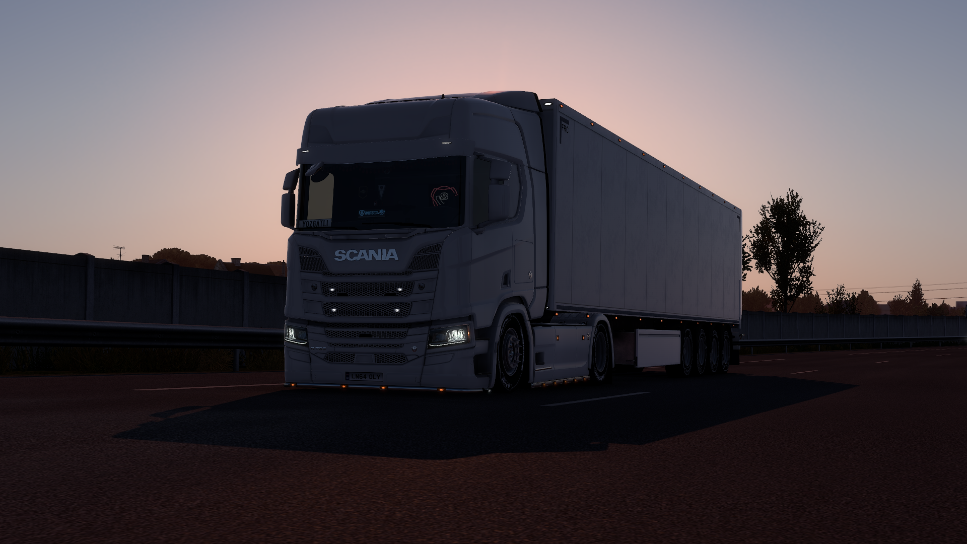 HD PC desktop wallpaper featuring a dark Scania R730 truck from Euro Truck Simulator 2, set against a twilight sky background.