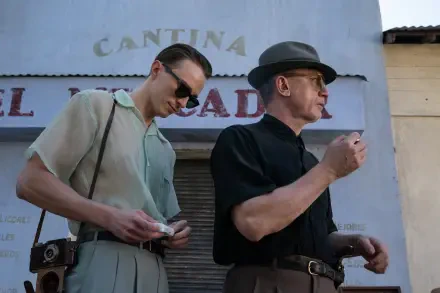 Two men stand outside a cantina, dressed in stylish retro attire. The image features actors Daniel Craig and Drew Starkey in a queer-themed movie scene, captured in vivid 4K Ultra HD.