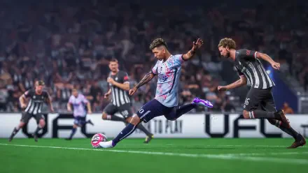 A dynamic scene from the video game UFL, featuring a player striking a soccer ball on a vibrant pitch, surrounded by teammates and opponents in an intense match setting.