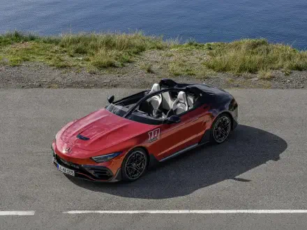 A striking Mercedes-AMG PureSpeed parked along a scenic road, showcasing its sleek design and sporty features. This eye-catching vehicle serves as a dynamic 4K Ultra HD desktop wallpaper.