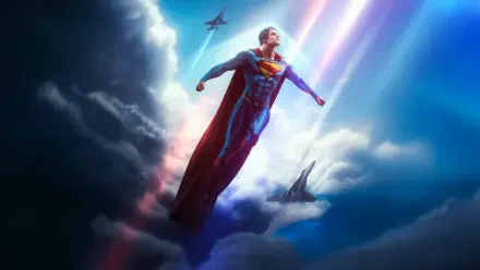 Superman (2025) soars above dramatic clouds with cape billowing, light beams and a distant jet — 5K Ultra HD PC desktop wallpaper and background.