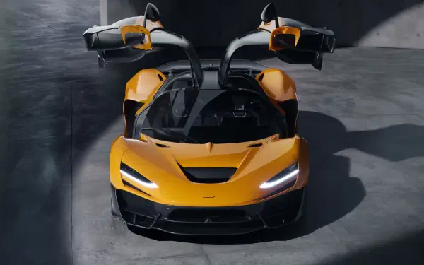 A McLaren W1 in striking yellow showcases its sleek design and distinctive gullwing doors. This 8K Ultra HD image serves as an impressive desktop wallpaper.