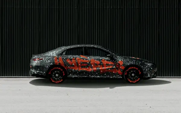 A sleek Mercedes-Benz CLA showcased in a striking design, featuring bold graphics. This HD image makes for an impressive desktop wallpaper and background.