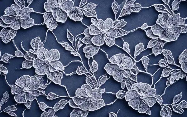 An intricate lace pattern featuring delicate flowers and leaves, set against a dark background, creating a stunning 4K Ultra HD desktop wallpaper.