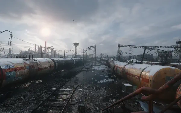 A desolate landscape from Metro Exodus featuring abandoned train cars and a cloudy sky, captured in high-definition as a striking PC desktop wallpaper.