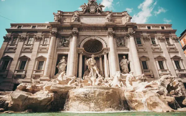 A stunning view of the Trevi Fountain in Rome, Italy, showcasing intricate architecture and elegant sculptures, captured in vibrant 4K Ultra HD resolution.