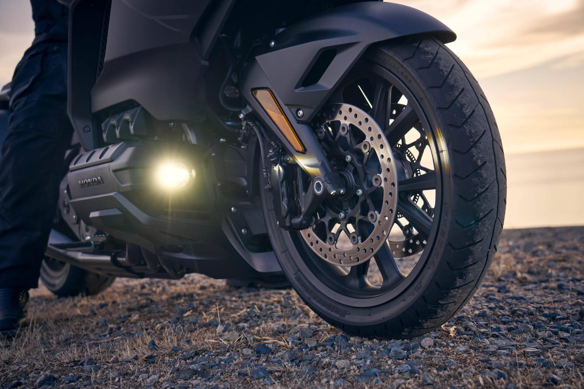 Close-up of the front wheel and engine of a 25YM Honda GL 1800 Gold Wing motorcycle, featured in an HD PC desktop wallpaper background.