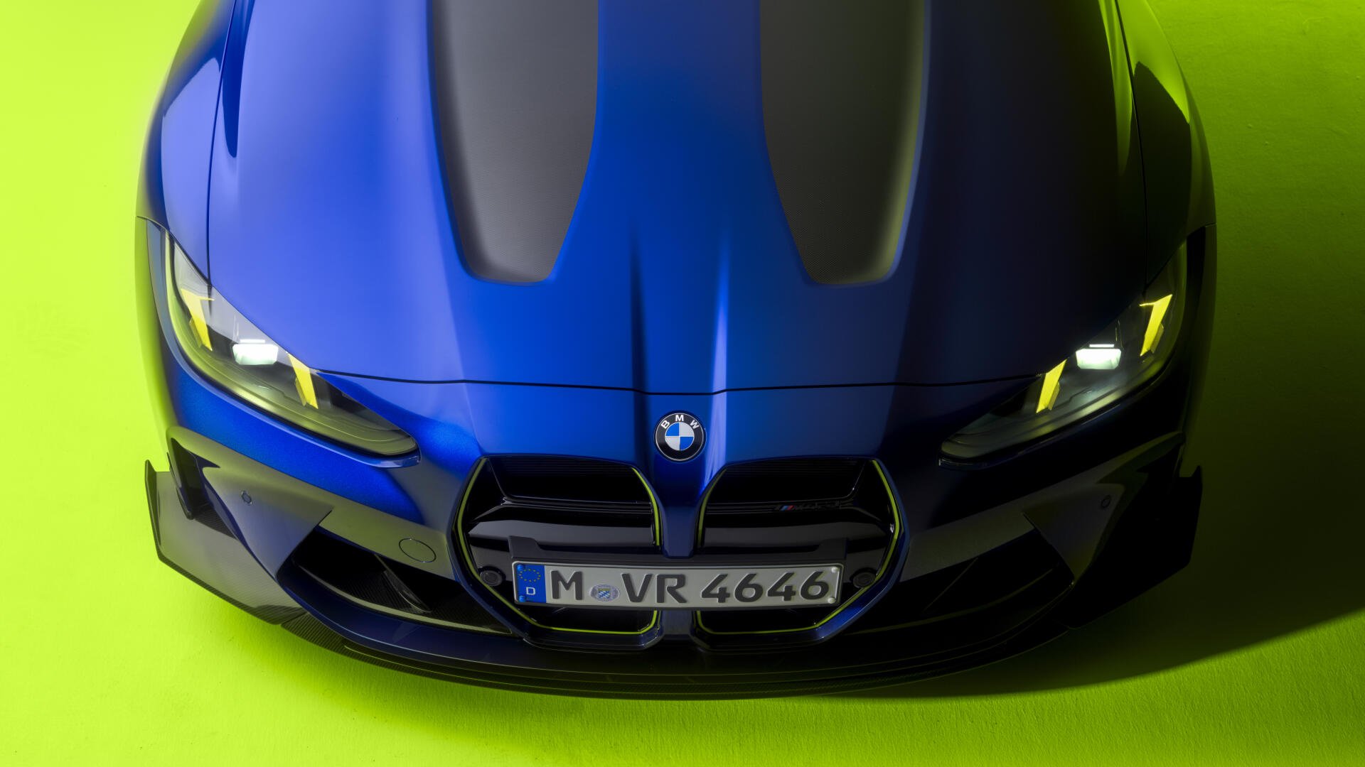 Front view of a blue BMW M4 CS Edition VR46 on a vivid lime-green background, high-detail 8K Ultra HD PC desktop wallpaper.