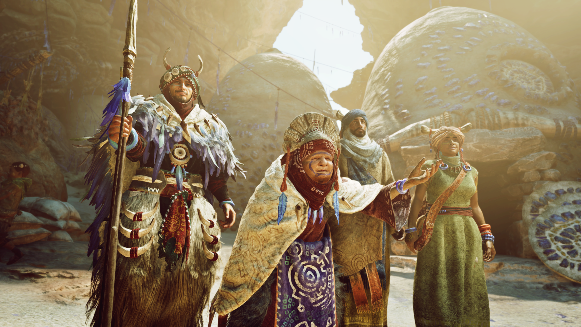 A group of characters from Monster Hunter stands together in a desert landscape, showcasing detailed armor and vibrant costumes, set against a backdrop of large, mysterious creatures.