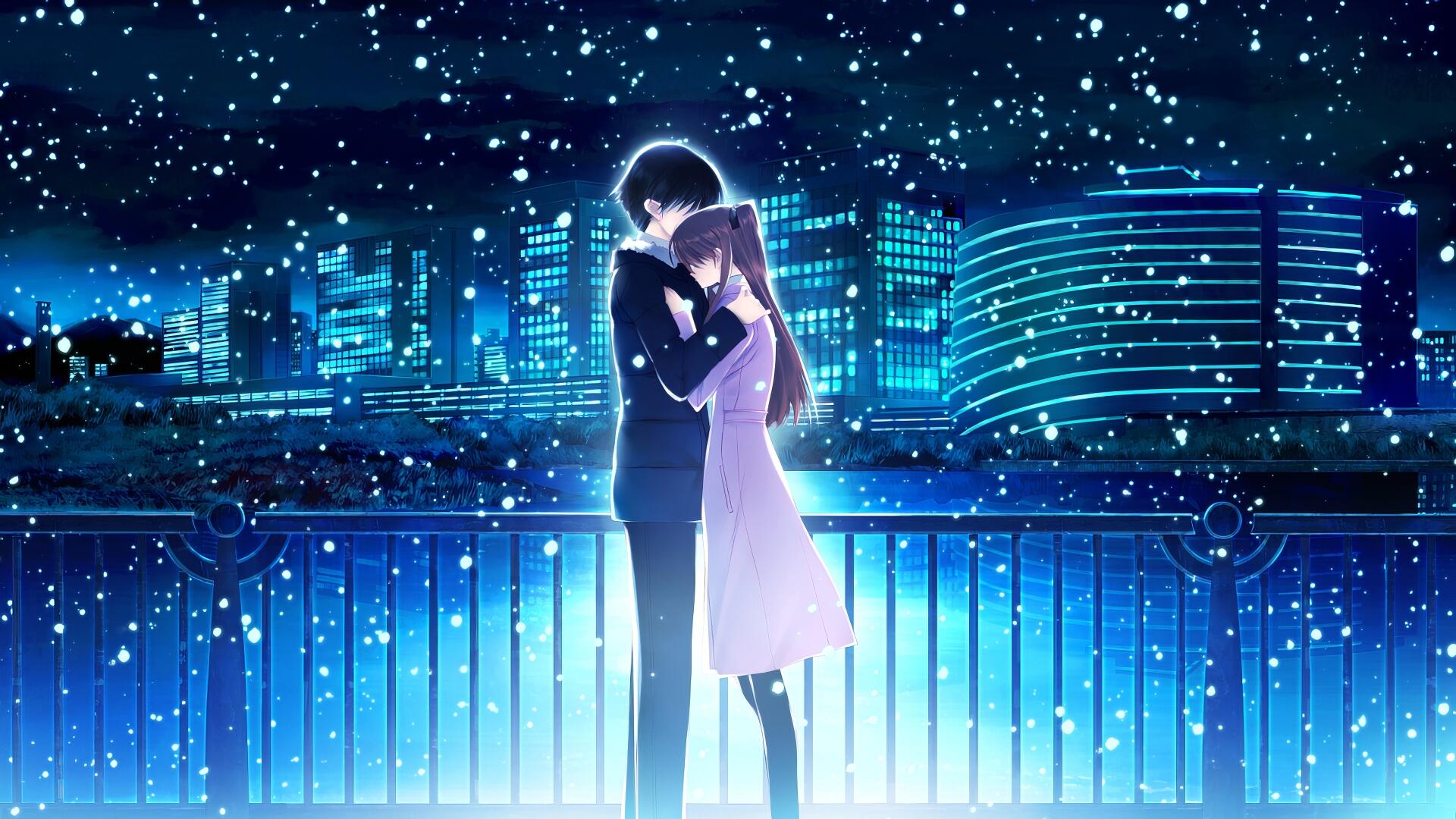 Anime couple from White Album 2 embraces under a snowy night sky, illuminated by blue city lights in this HD desktop wallpaper and background.