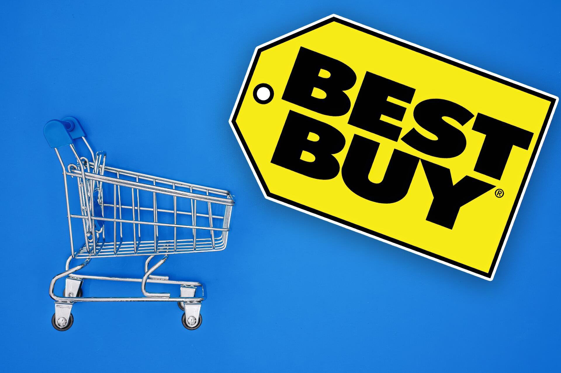 HD PC desktop wallpaper featuring a miniature shopping cart and a bold yellow Best Buy tag on a vibrant blue background, showcasing man-made design elements.