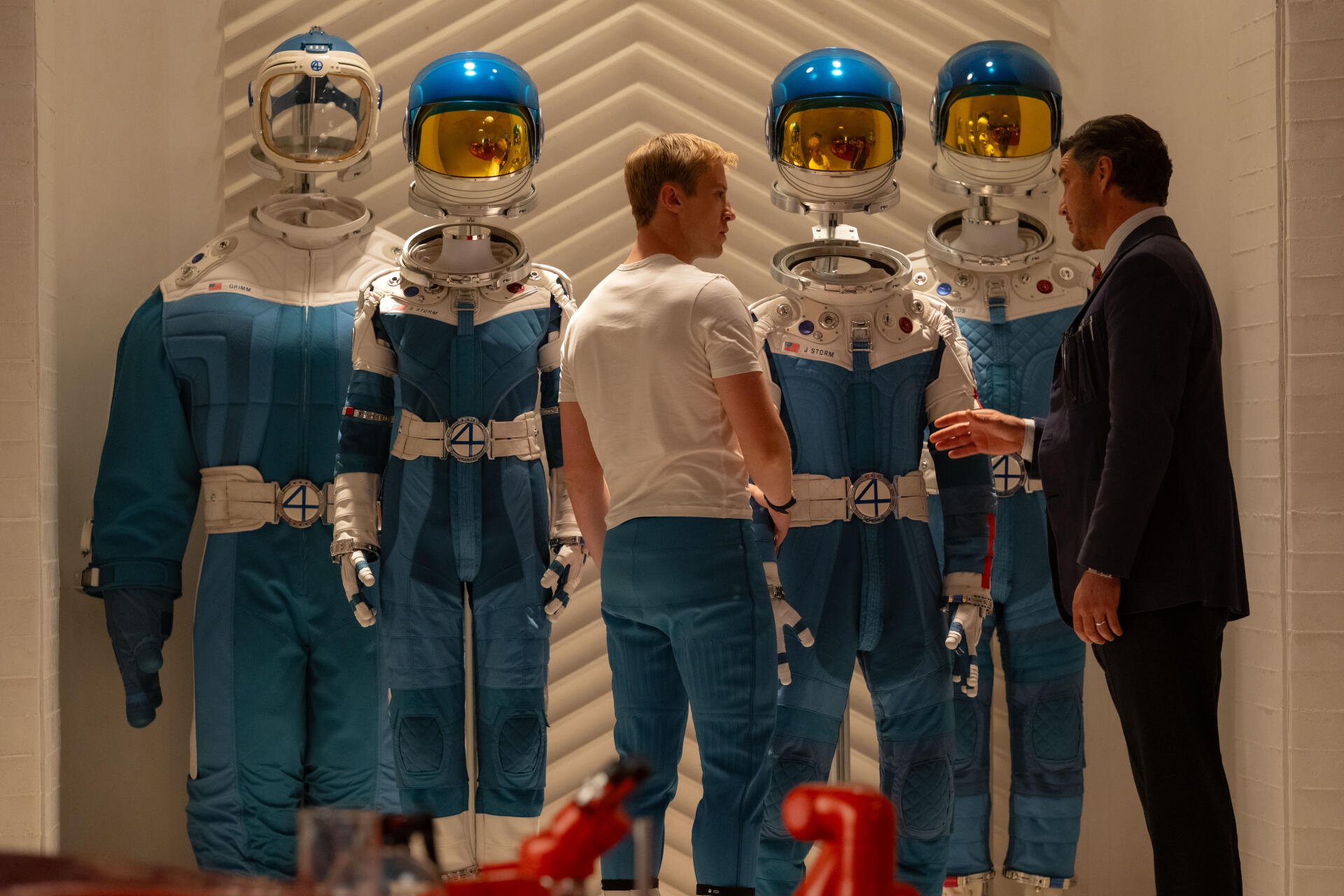 Scene from Fantastic Four (2025) featuring characters in futuristic blue spacesuits, captured in 8K Ultra HD for PC desktop wallpaper and background.